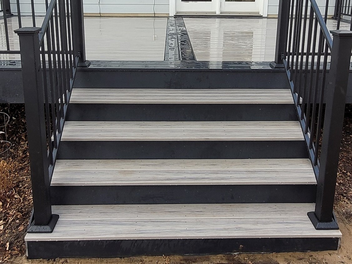 Two-toned deck stairs on a composite deck in Colorado Springs