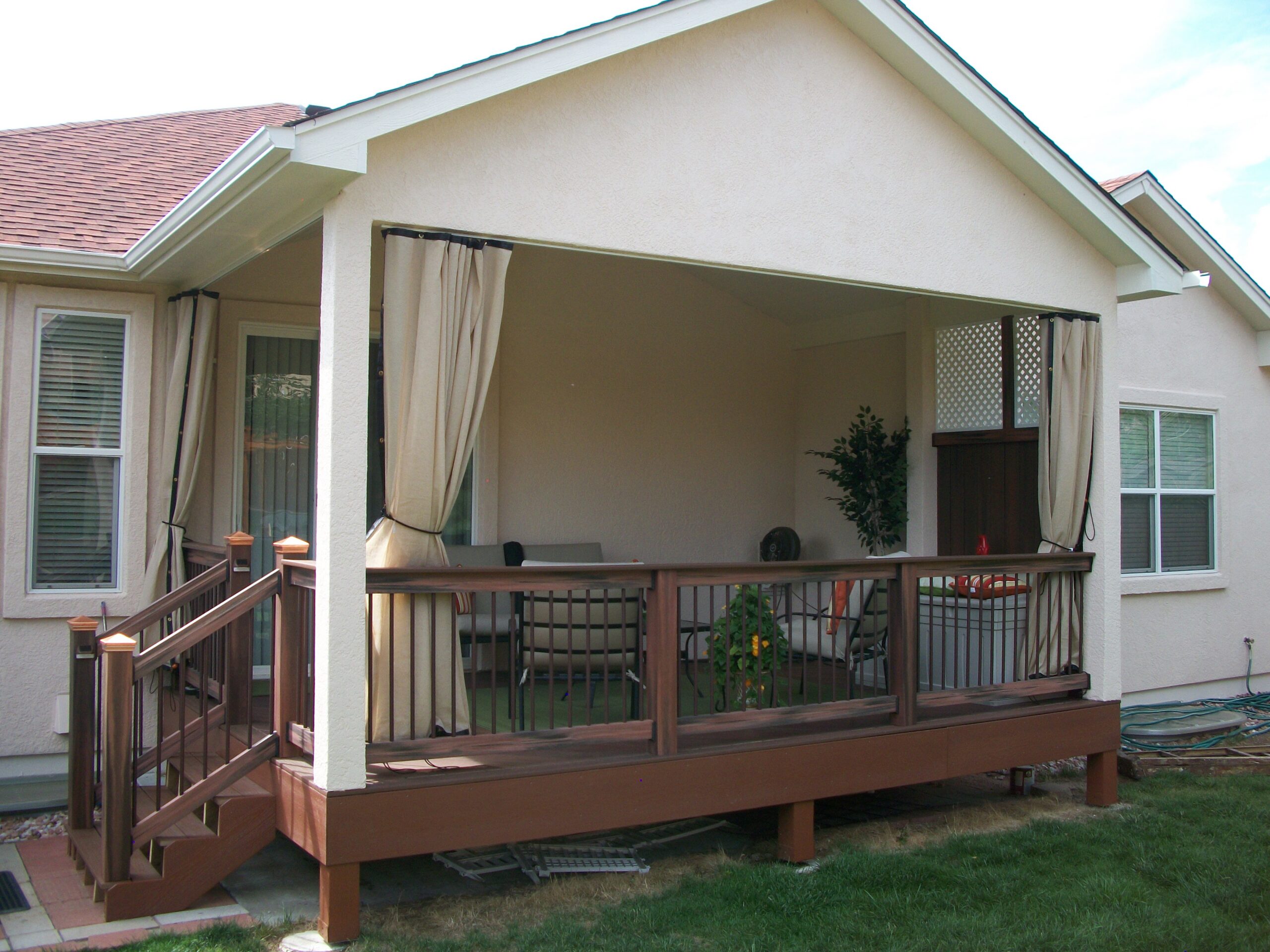 Composite deck with gabled deck cover featuring a flat tongue and groove ceiling