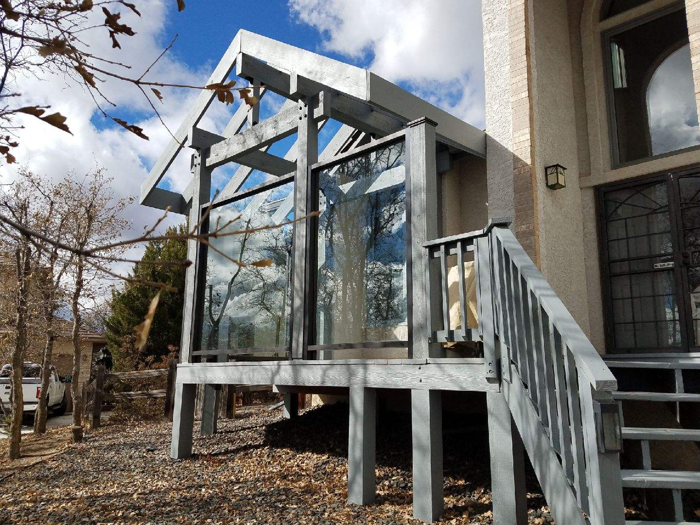 Glass panels create windbreaks on a composite deck in Gleneagle Colorado Springs