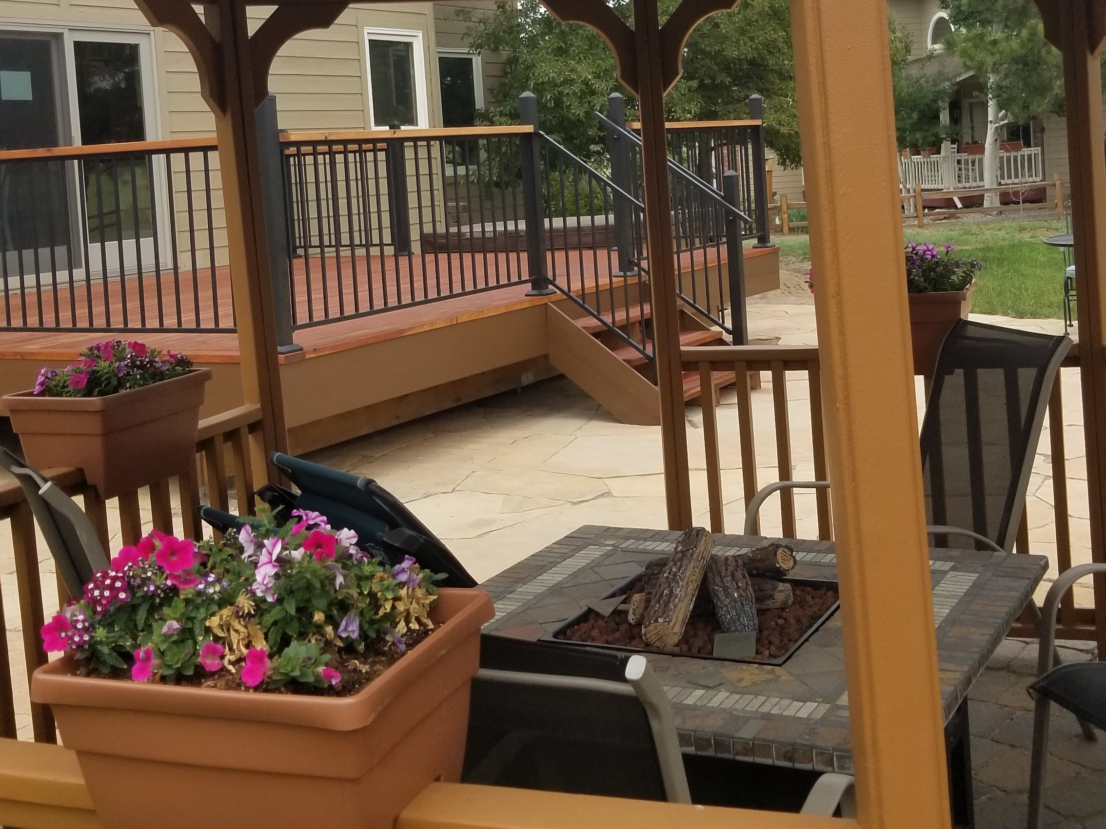 Heart redwood deck in Gleneagle Colorado Springs with a separate gazebo featuring a firepit
