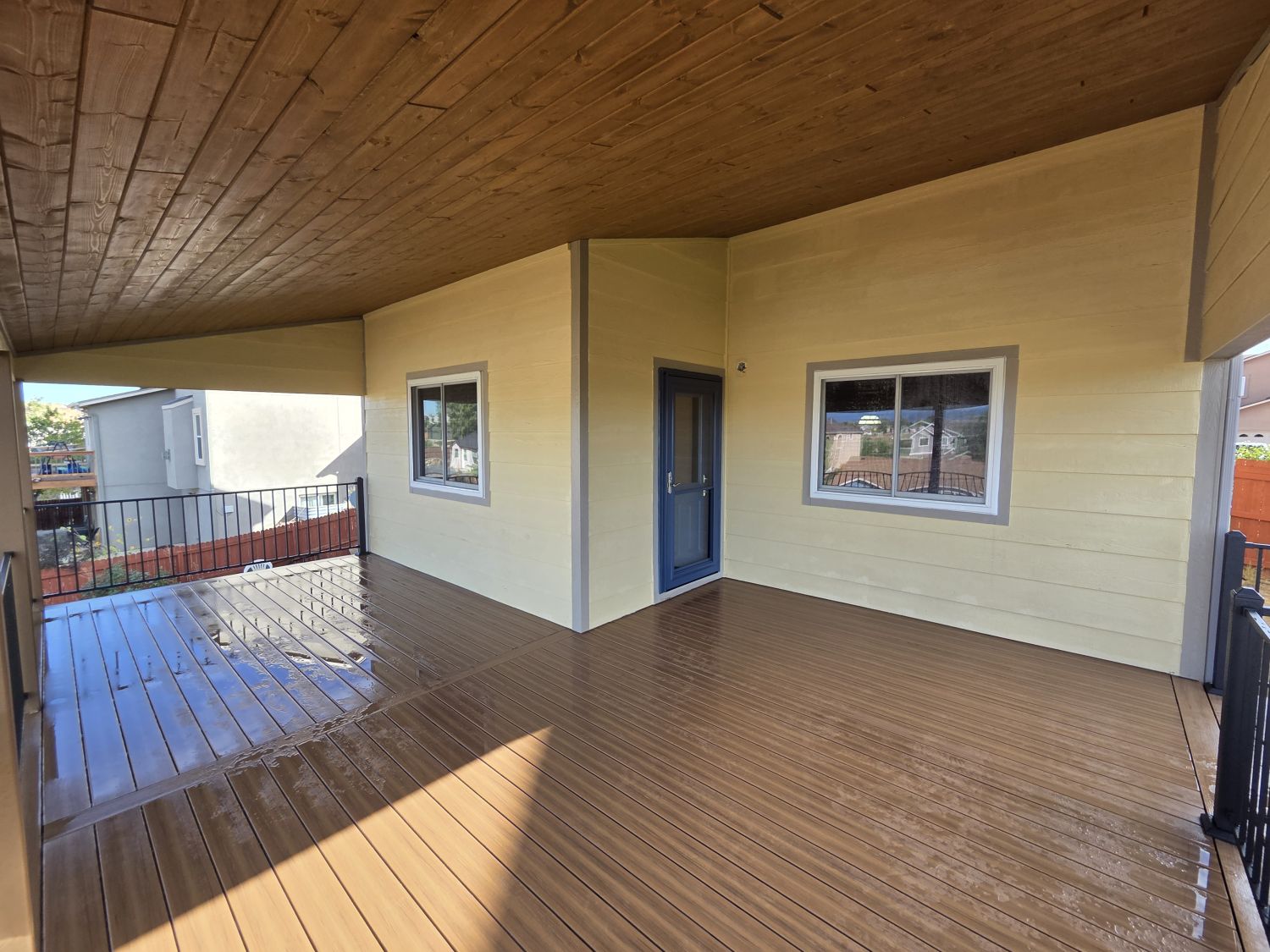 Custom outdoor living space with Deckorators composite deck and deck cover in Colorado Springs
